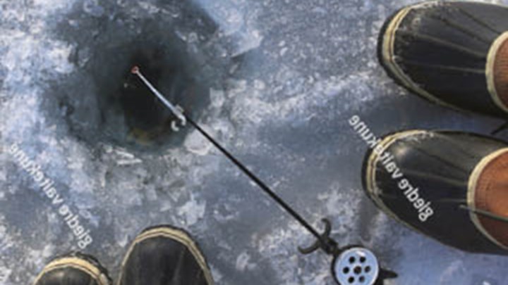 Ice fishing hole from a downwards perspective
